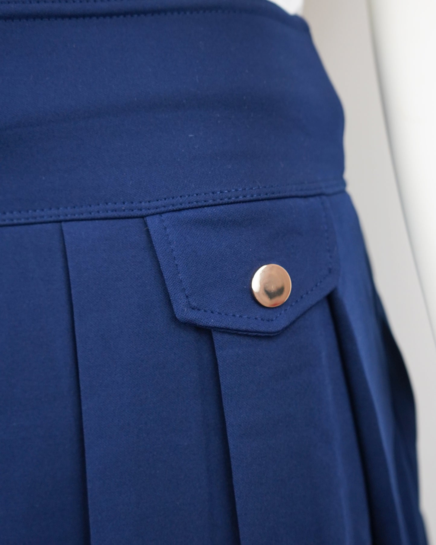 Stretchy Mini Skirt with Built-in Shorts & Side Button Detail